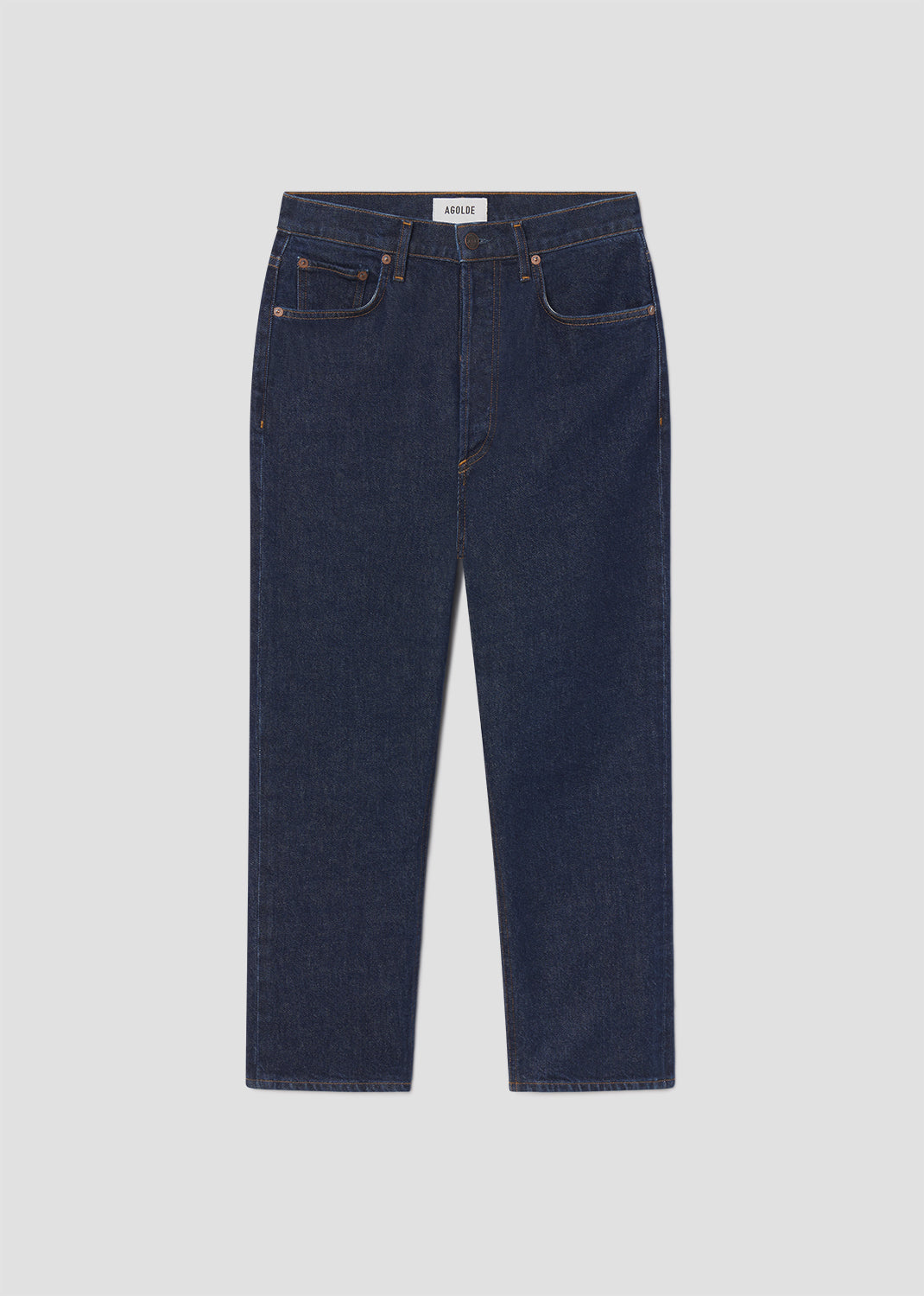 Pair of dark blue jeans on a light gray background