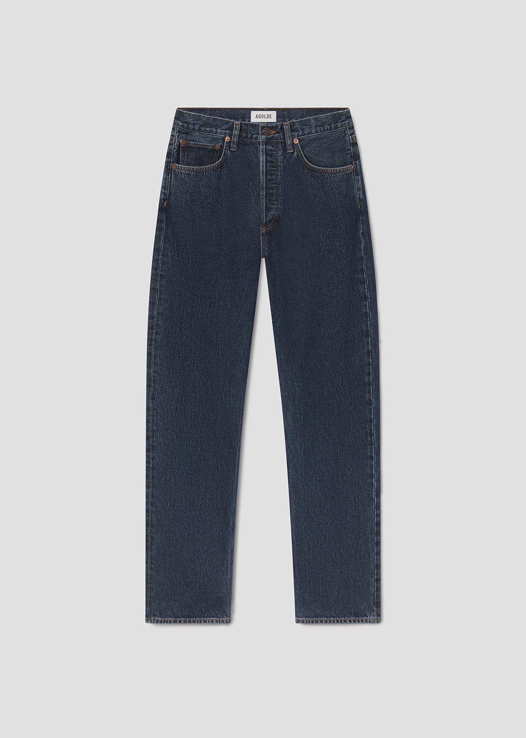 Pair of dark blue jeans on a light gray background