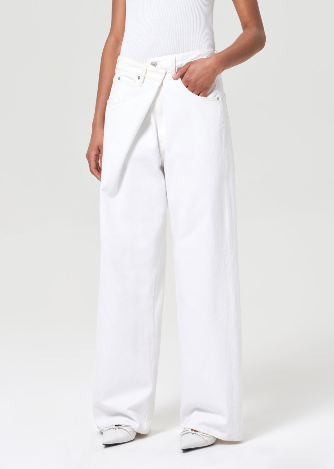 White wide-leg pants worn by a person on a white background
