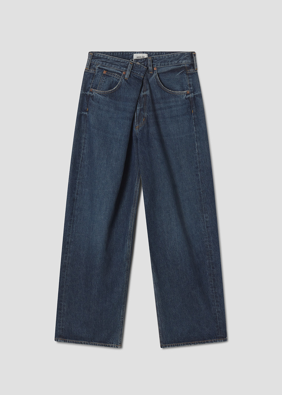 Pair of blue jeans on a light gray background