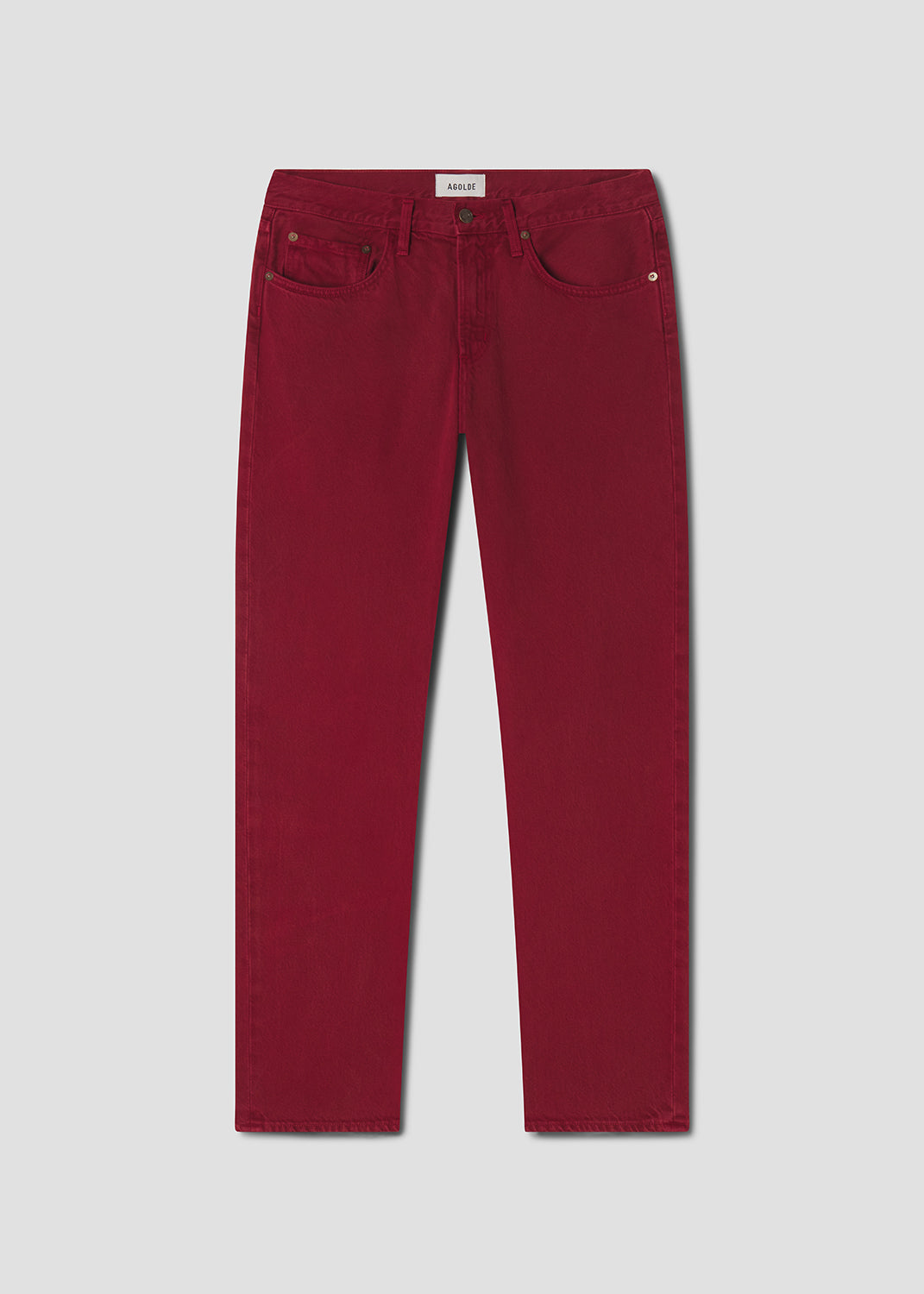 Red jeans on a light gray background