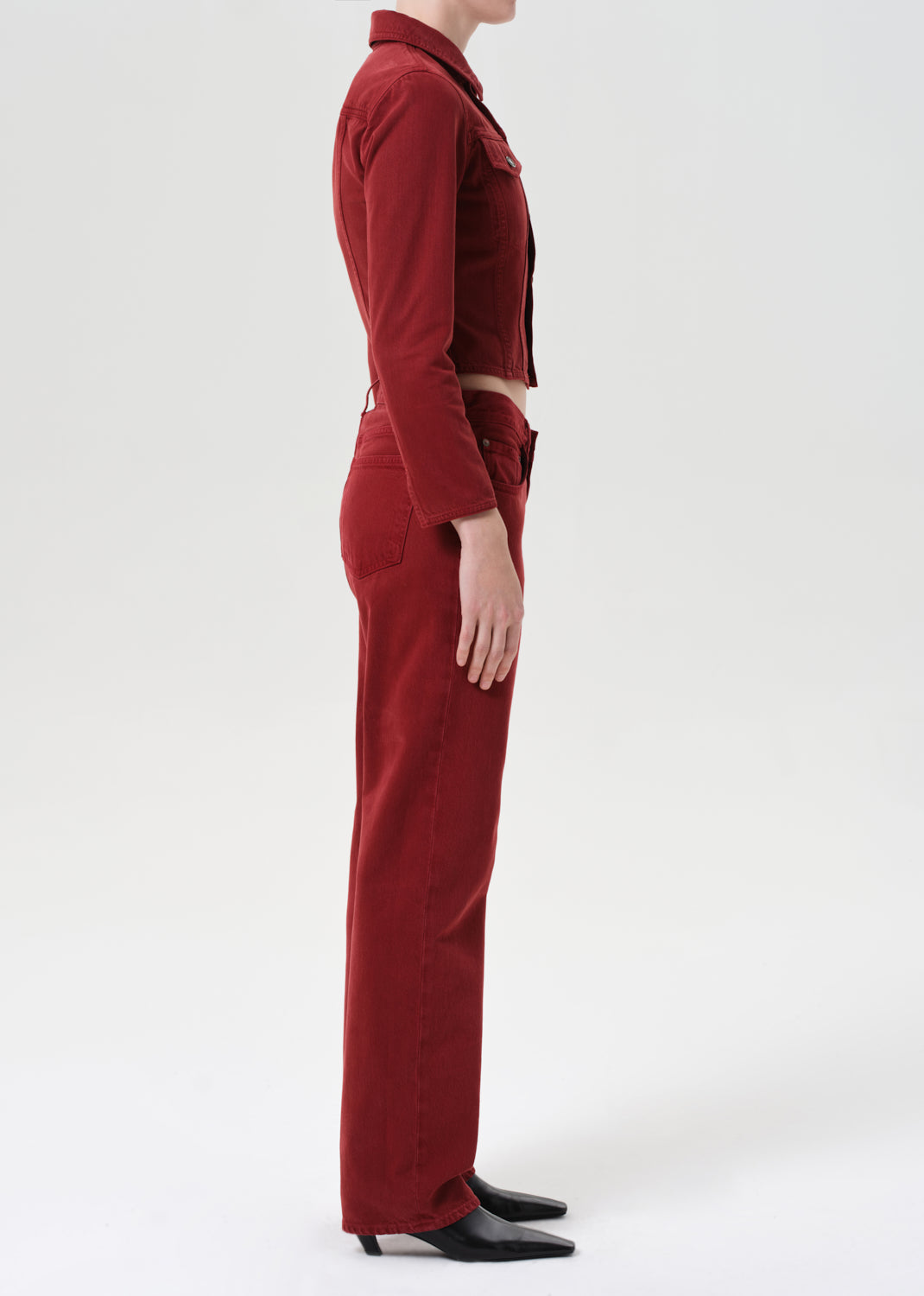 Person wearing a red outfit on a white background