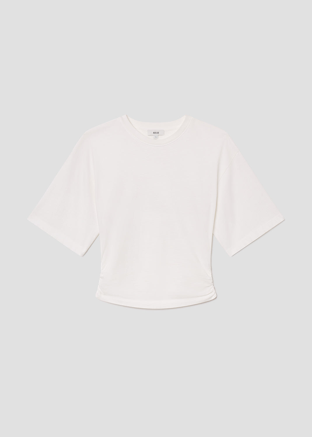 White blouse with a wide collar on a light gray background