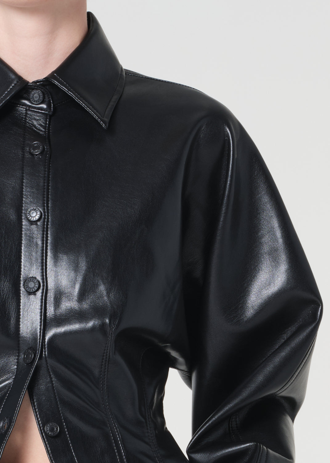 Black leather shirt on a plain background