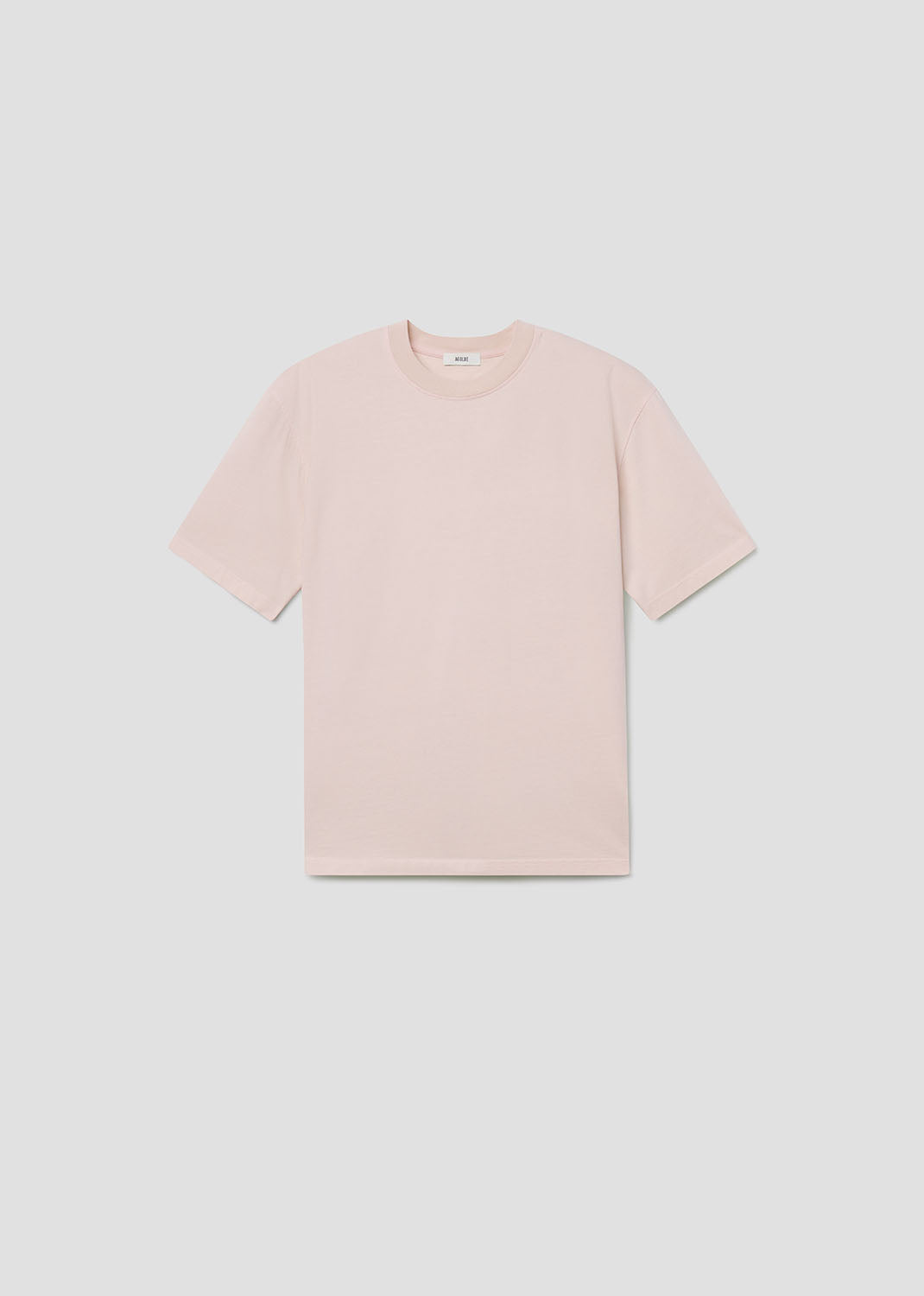 Light pink t-shirt on a light gray background
