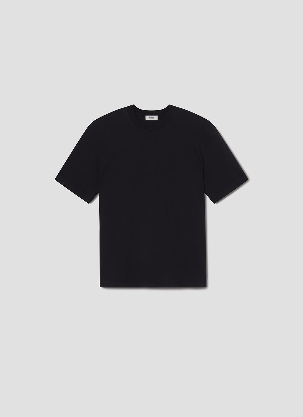 Black t-shirt on a grey background