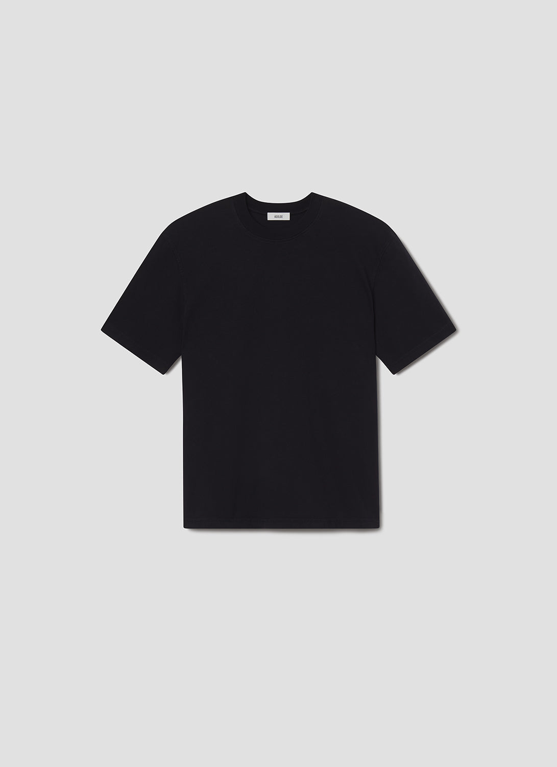Black t-shirt on a grey background