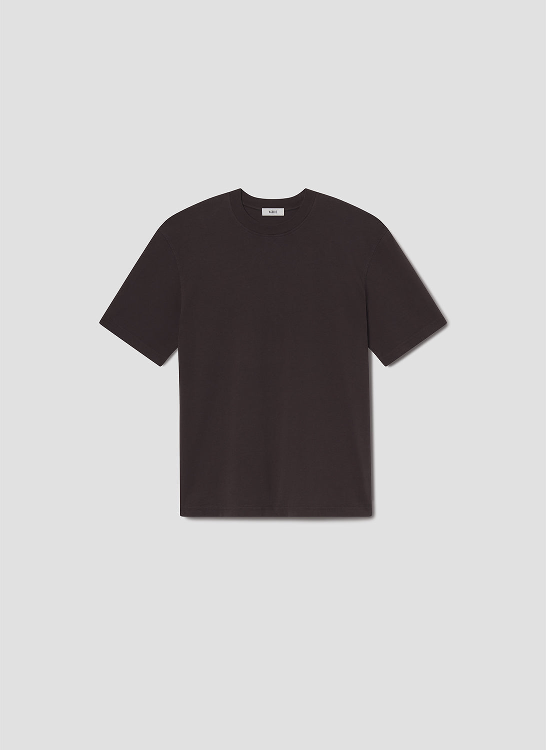 Black t-shirt on a light grey background