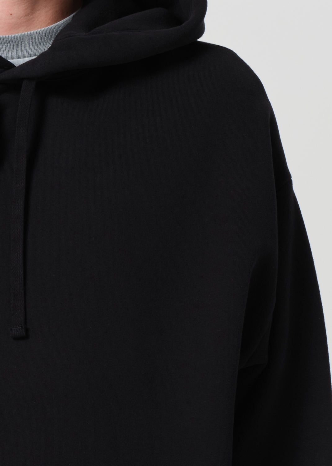 Black hoodie on a light gray background