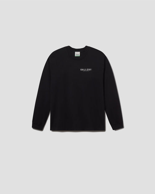 A black long-sleeve crewneck sweatshirt with 'GALLERY' printed in white text on the left chest, displayed against a light gray background.