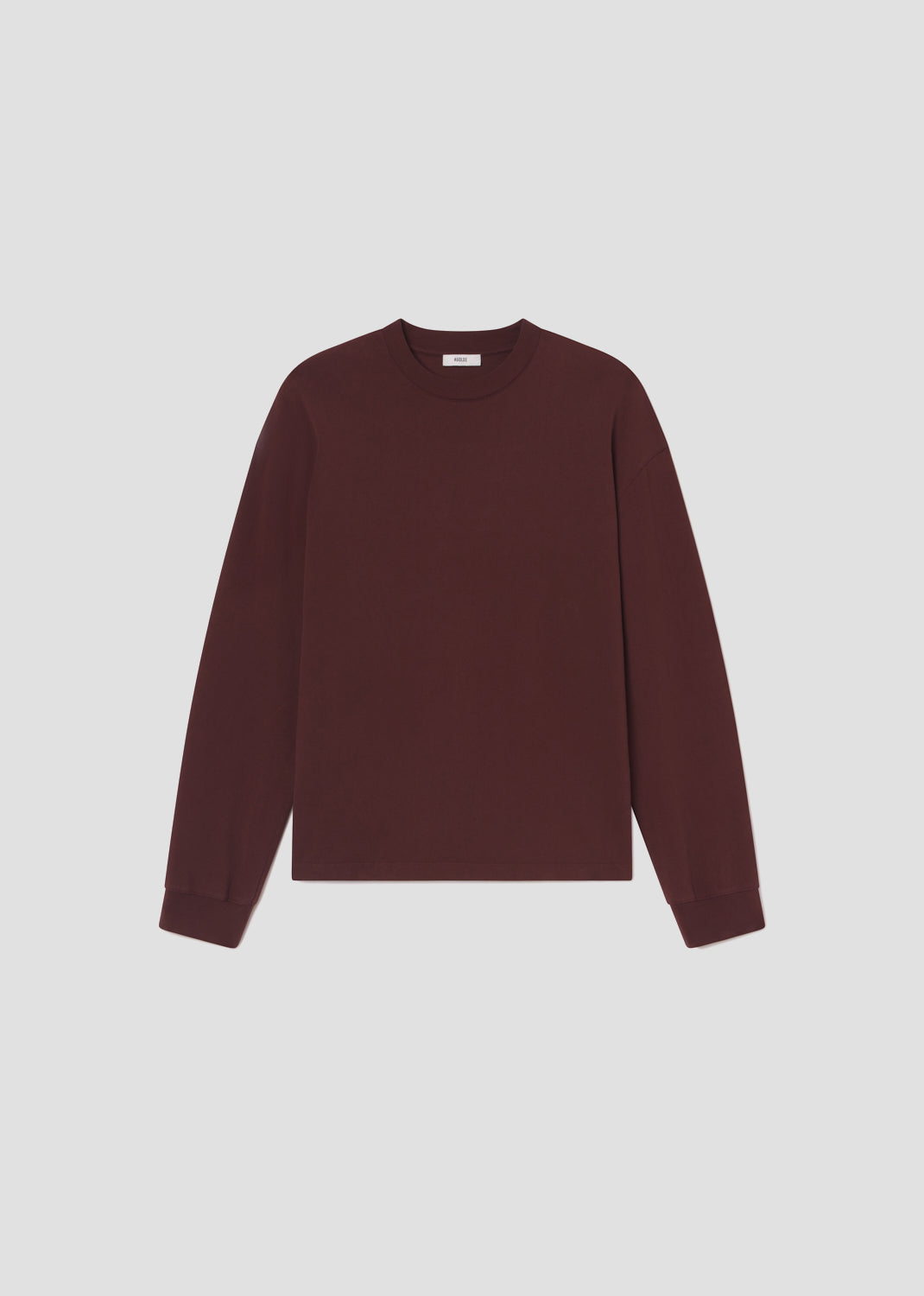 Maroon sweater on a light gray background