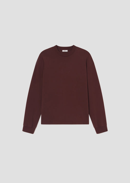 Maroon sweater on a light gray background