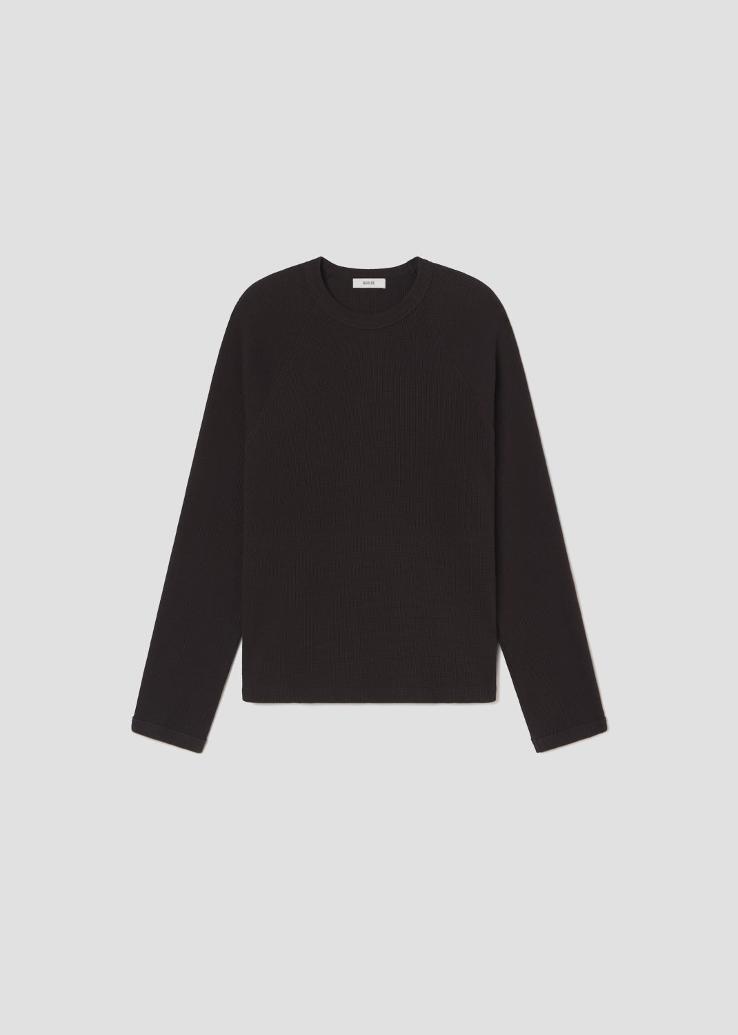 Black long-sleeve shirt on a light gray background