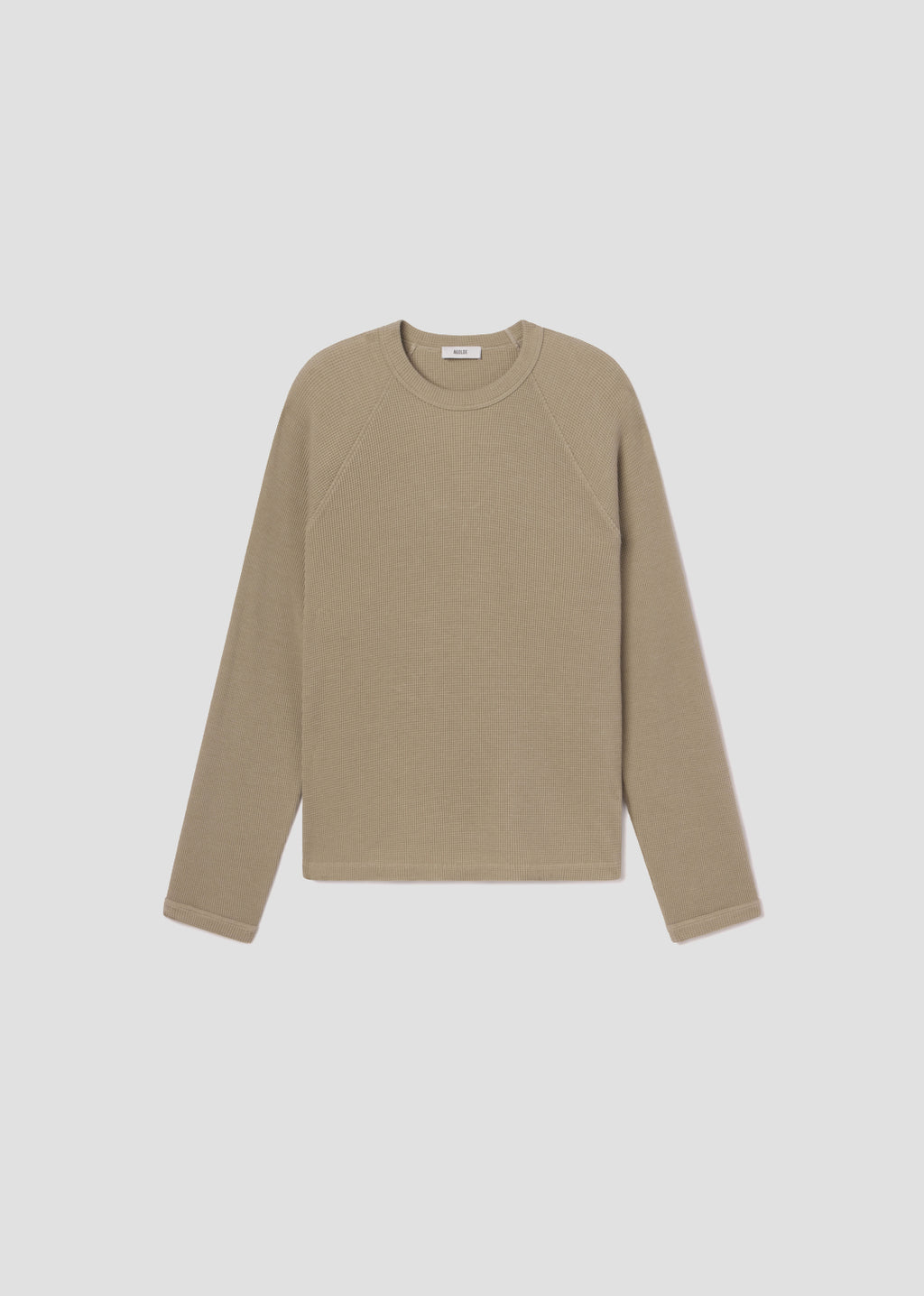 Beige long-sleeve shirt on a light gray background