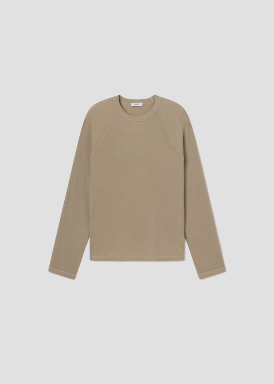 Beige long-sleeve shirt on a light gray background