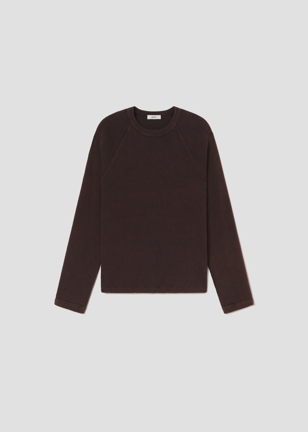 Brown long-sleeve shirt on a light gray background