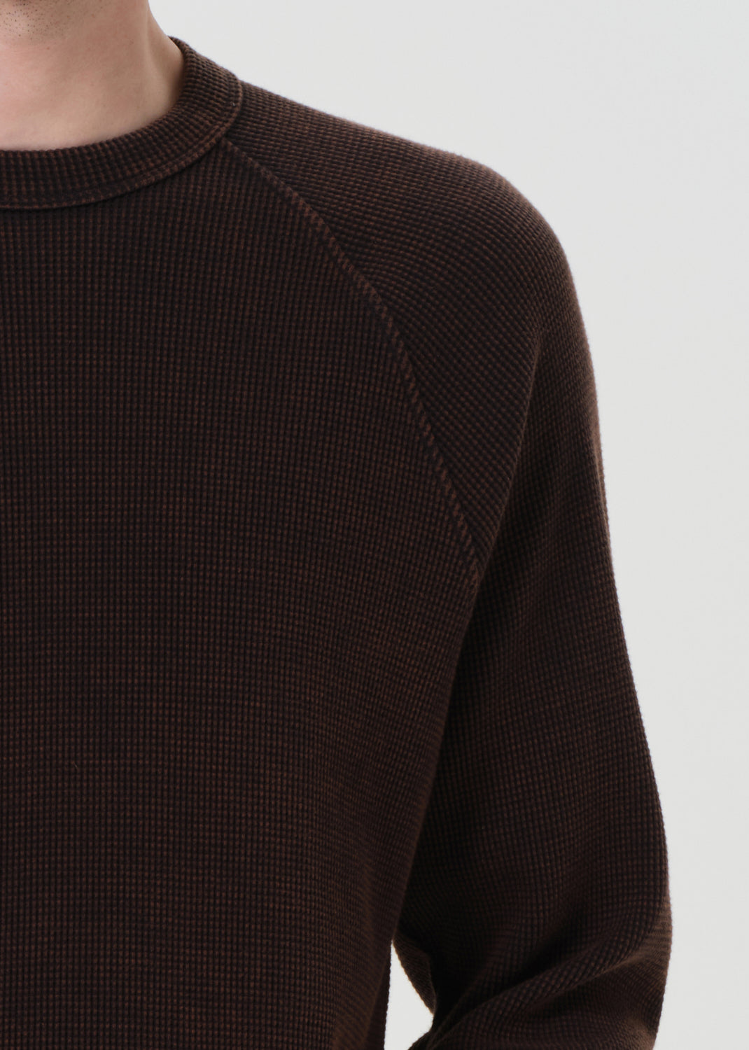Brown sweater on a white background