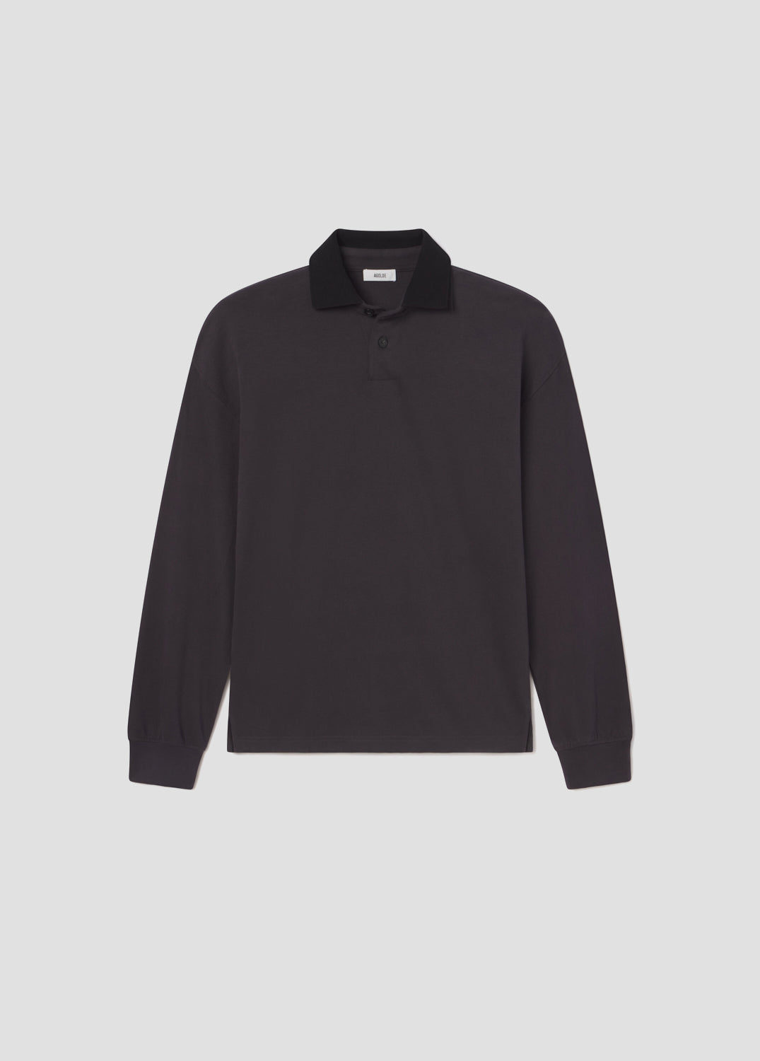 Black long-sleeve polo shirt on a light gray background
