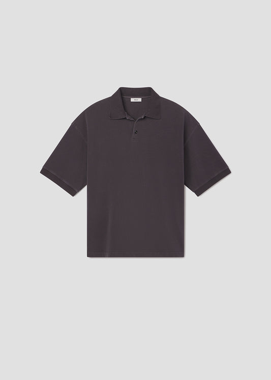 Dark gray polo shirt on a light gray background