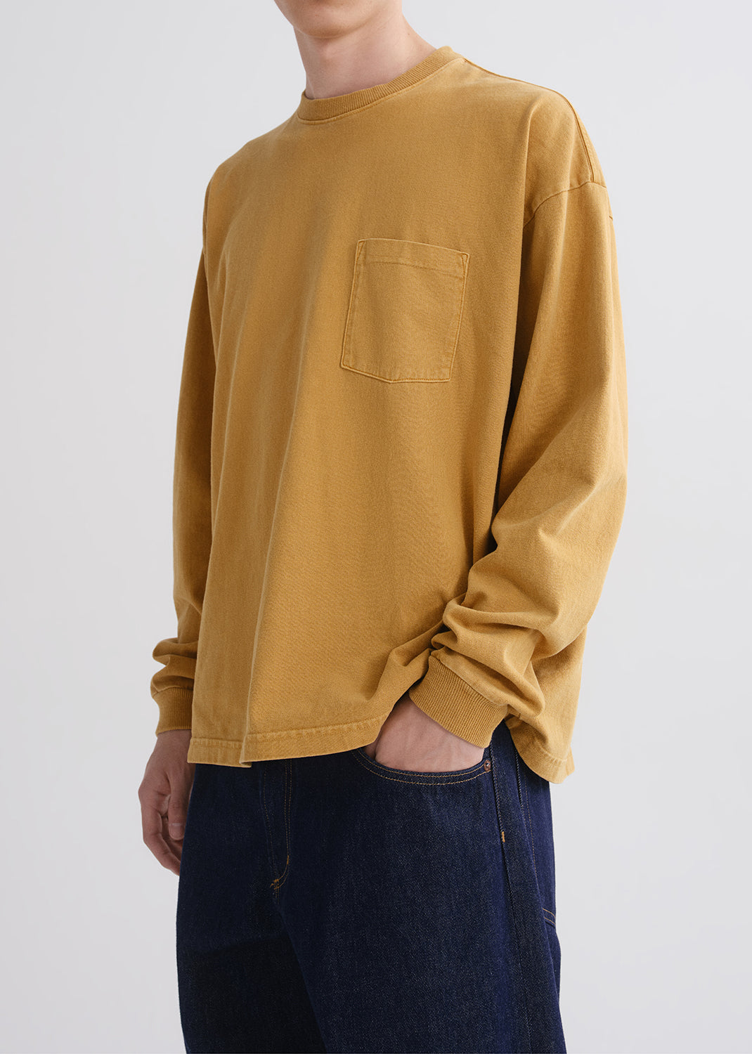 Close up of person wearing yellow shirt 