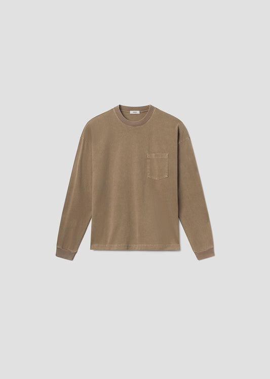 Flat lay shot of brown tee on grey background