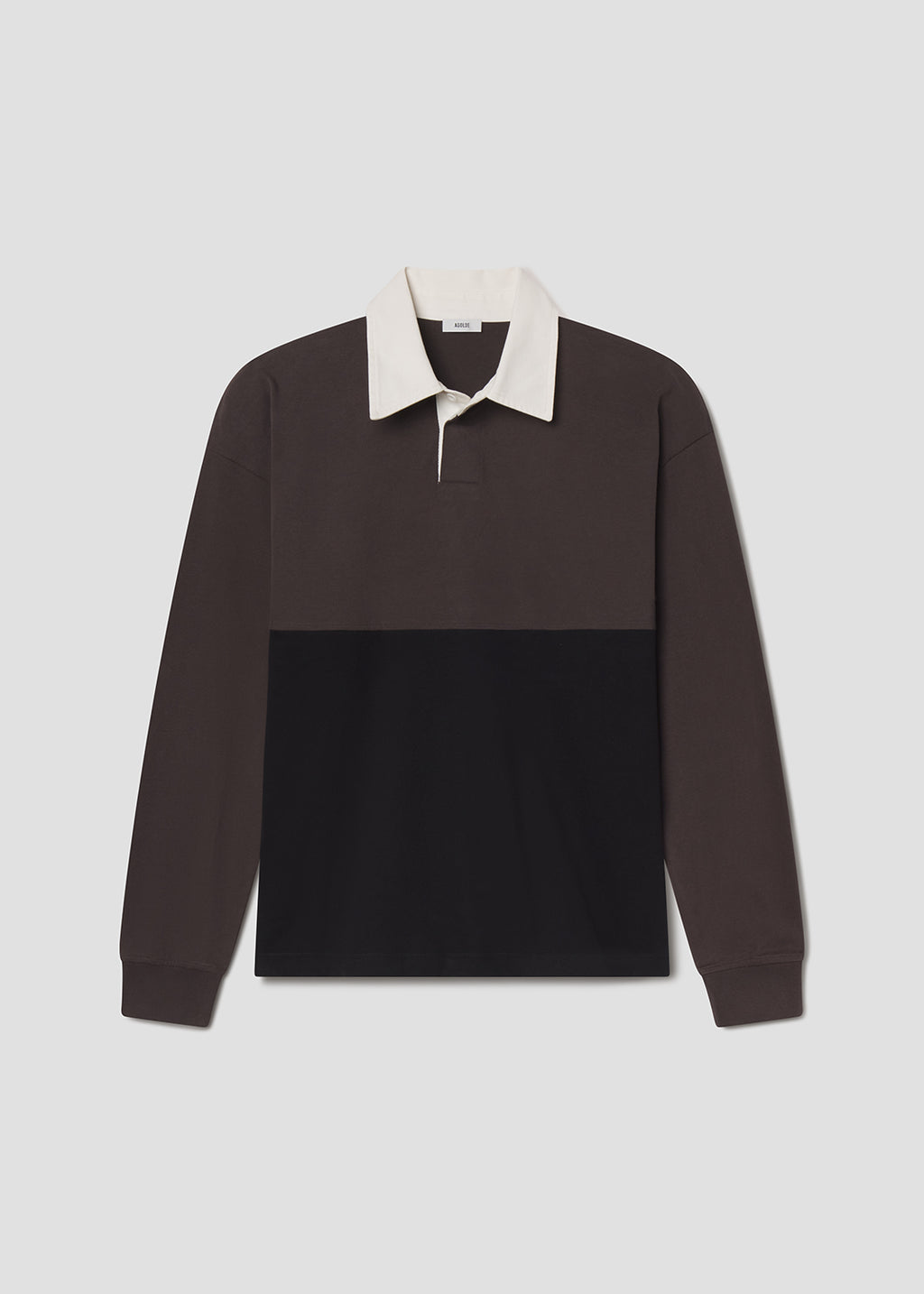Two-tone brown shirt with white collar on a grey background