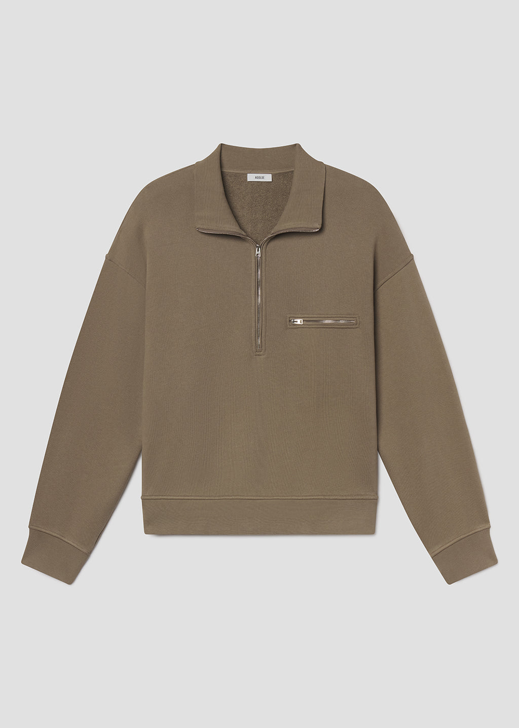 Flat lay shot of brown pullover with a zipper on a grey background