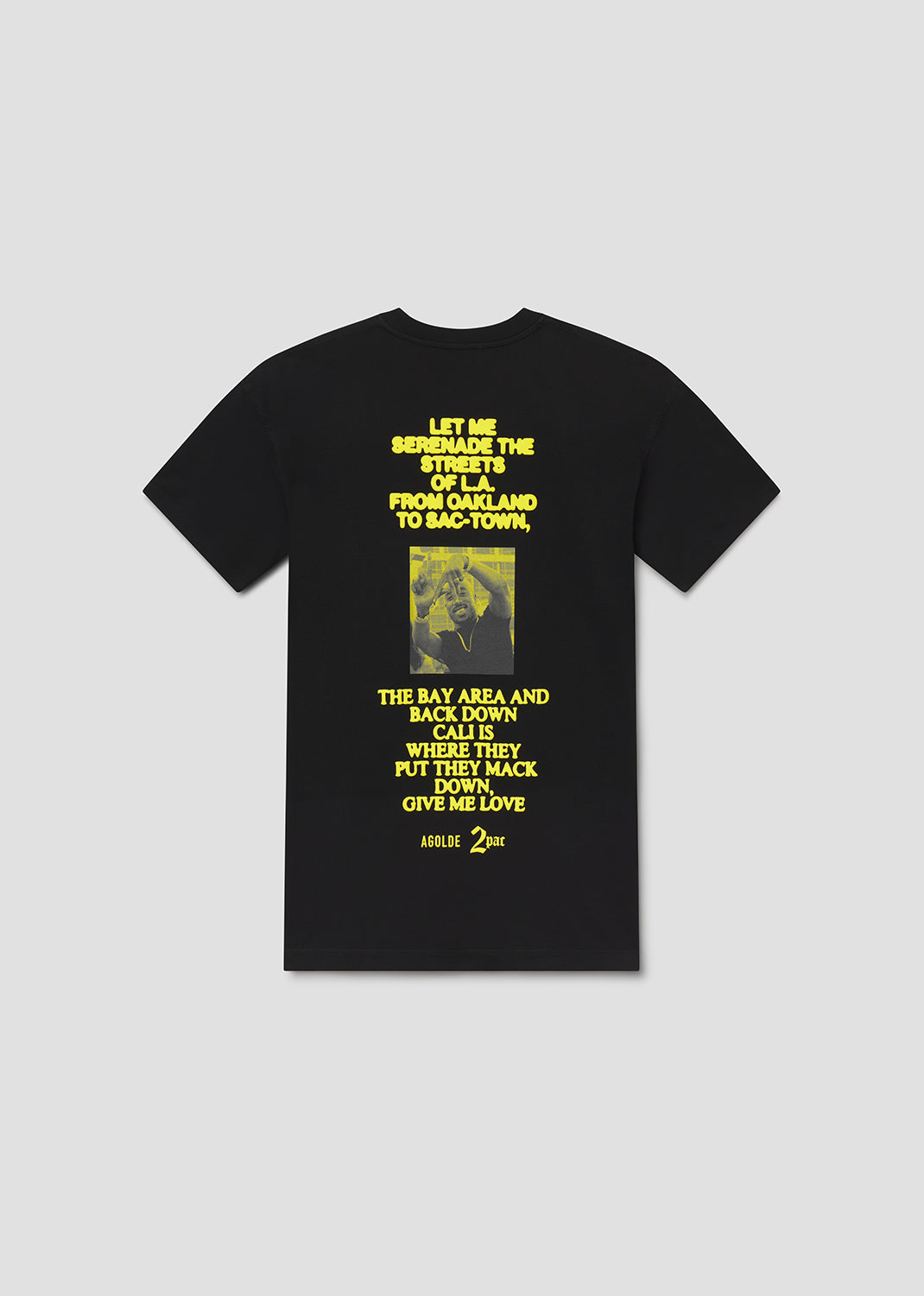 Black t-shirt with yellow text and graphic on a gray background