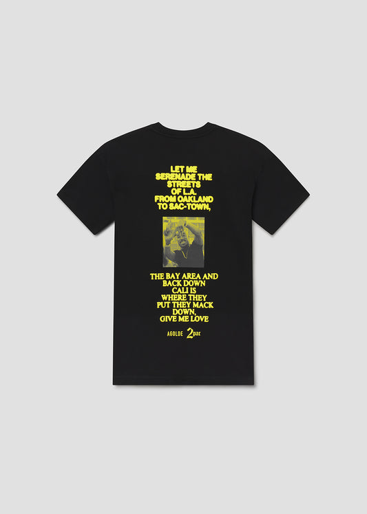 Black t-shirt with yellow text and graphic on a gray background