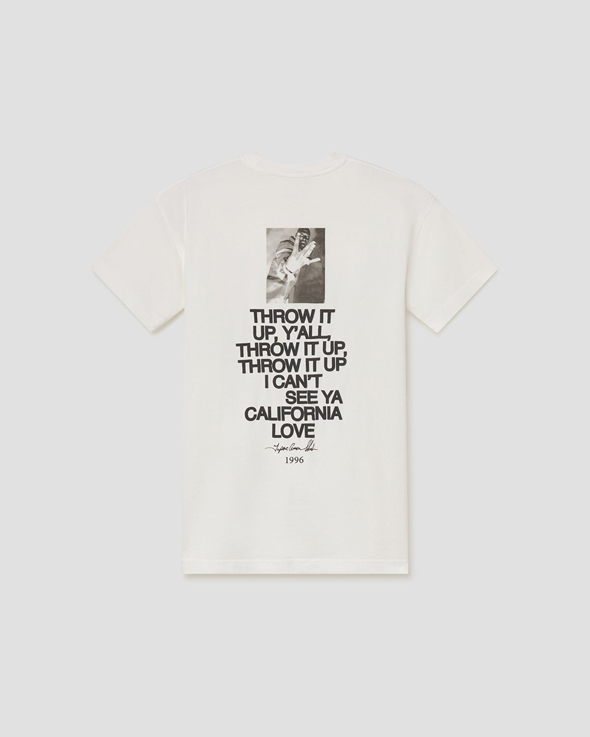 An off-white short-sleeve t-shirt with a black graphic print on the front, featuring a small photo of a hand holding a guitar above the text 'THROW IT UP, Y'all. THROW IT UP, I can't SEE YA CALIFORNIA LOVE' and '1976' at the bottom.