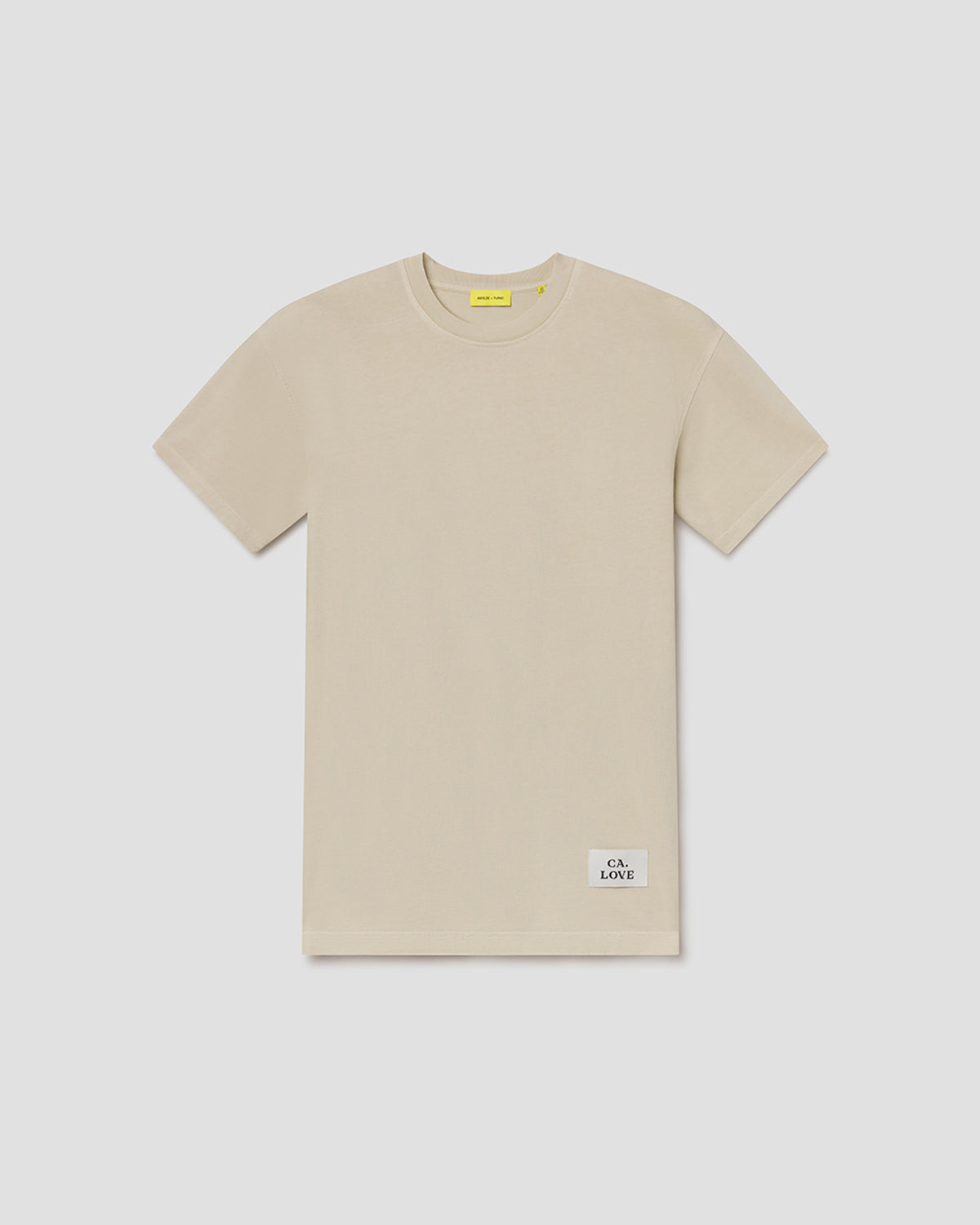 A light beige short-sleeve crewneck t-shirt with a small white 'C.L.