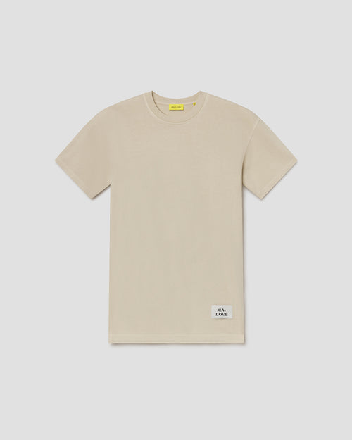 A light beige short-sleeve crewneck t-shirt with a small white 'C.L.