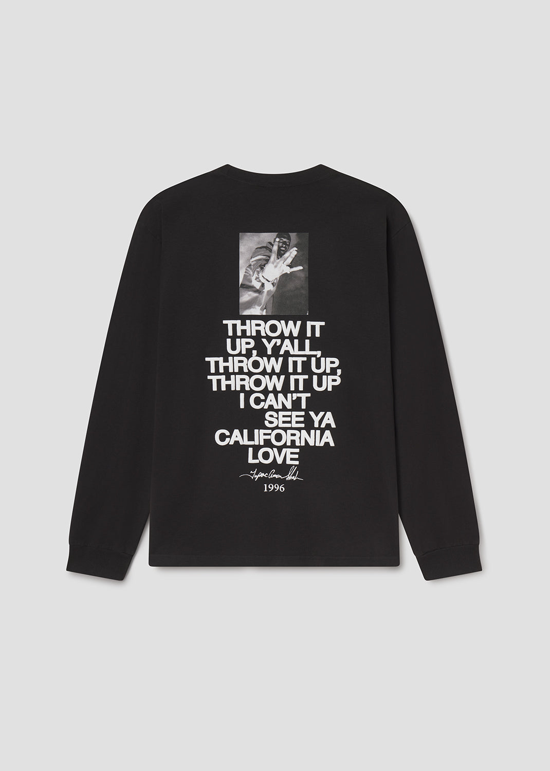 Black long-sleeve shirt with white text and a small graphic on a light gray background