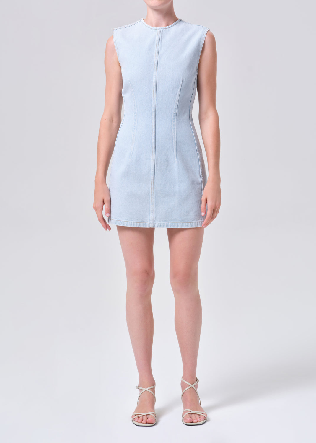 Light blue dress worn by a model on a white background
