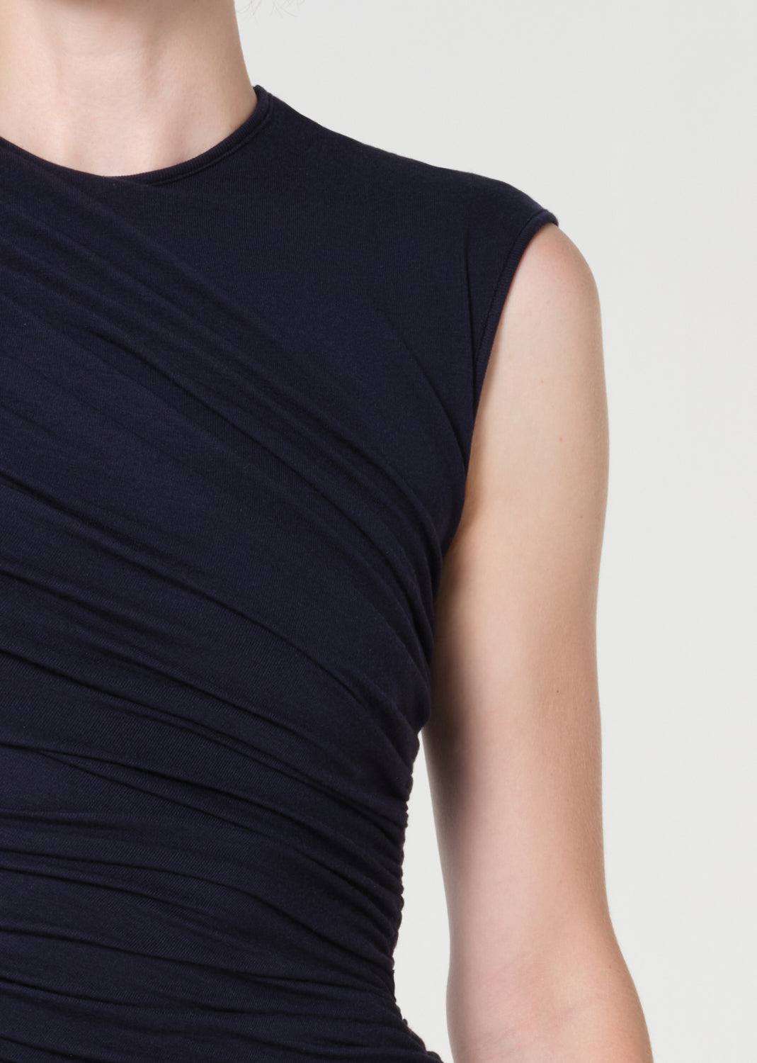 Navy blue sleeveless dress on a neutral background