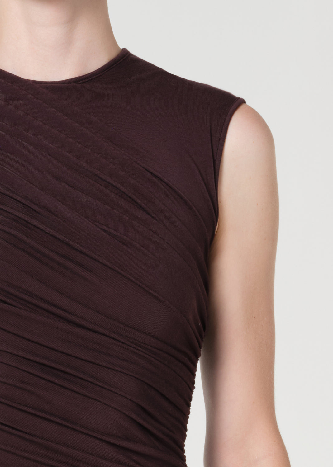 Brown sleeveless dress on a plain background