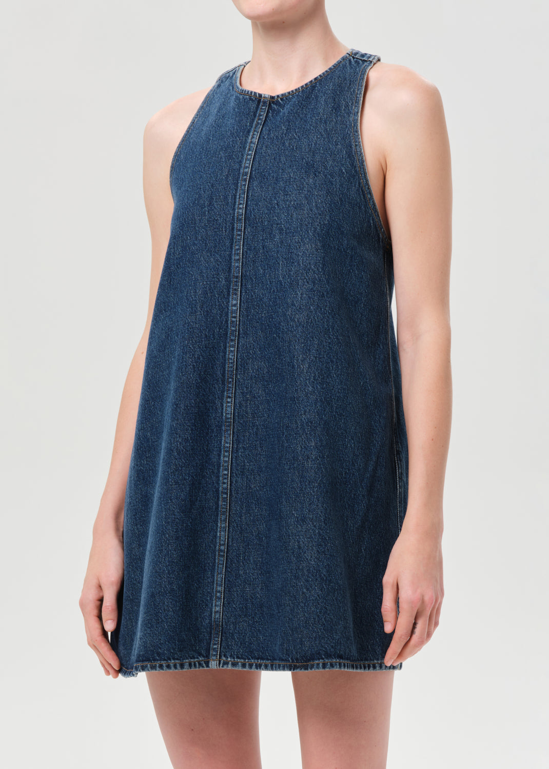 Denim dress worn by a person on a light gray background