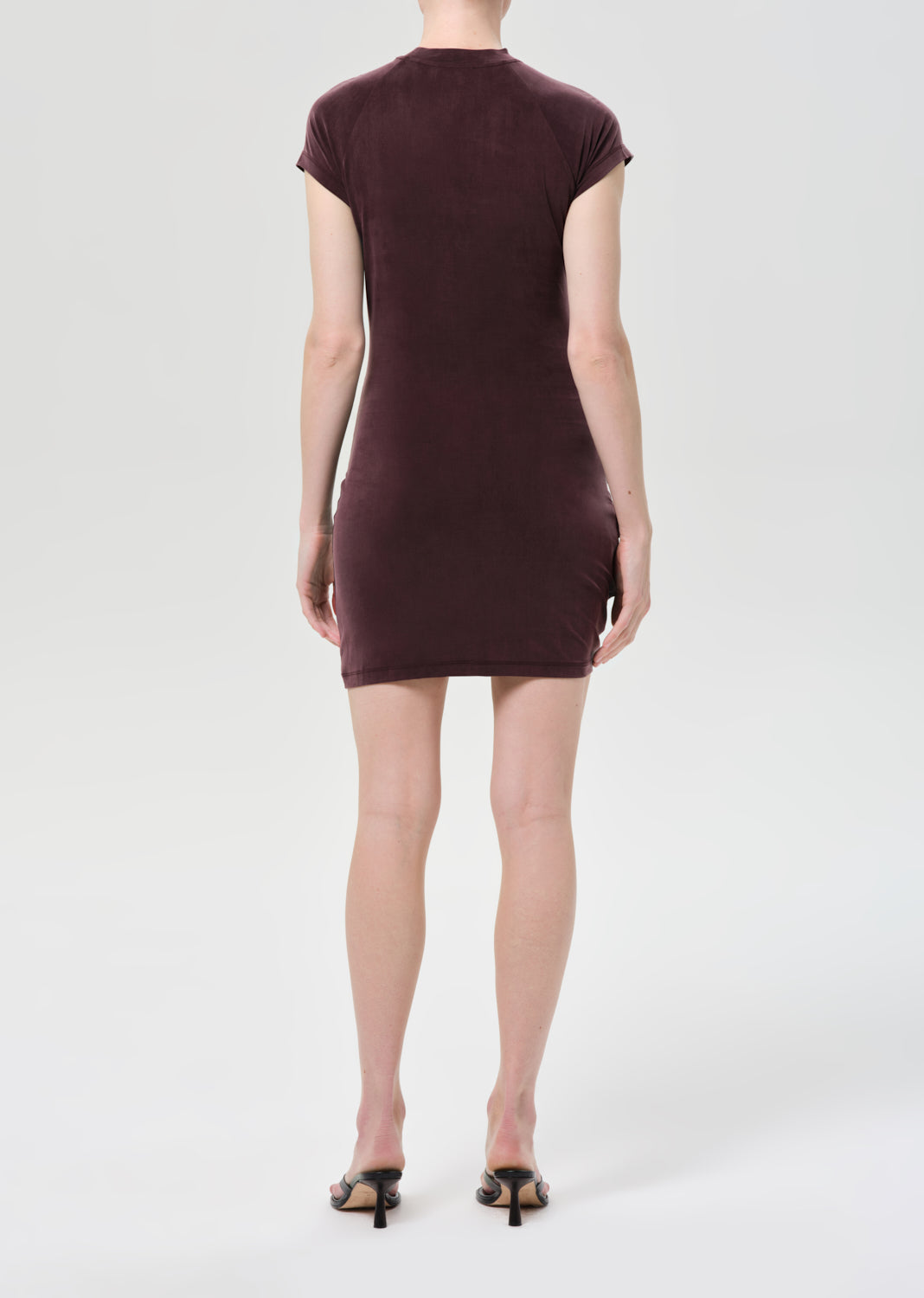 Brown dress worn by a person on a white background