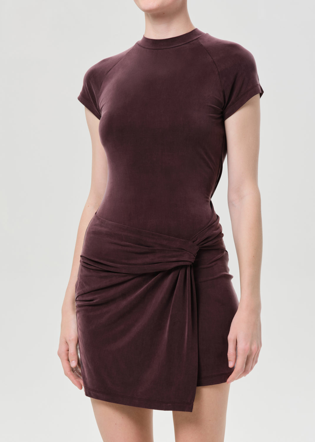 Brown dress with a knot detail on a white background