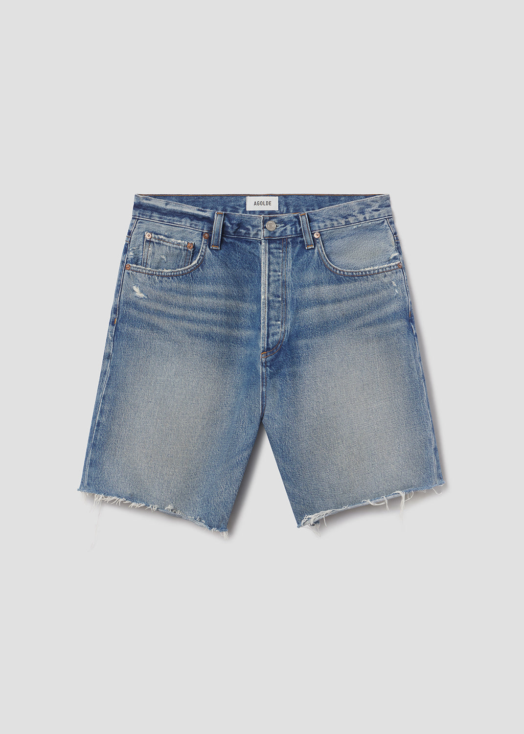 Blue denim shorts on a light gray background