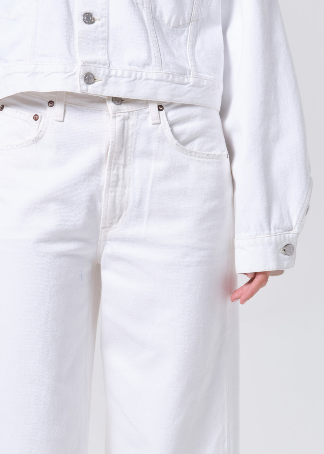 White denim jacket and jeans on a white background