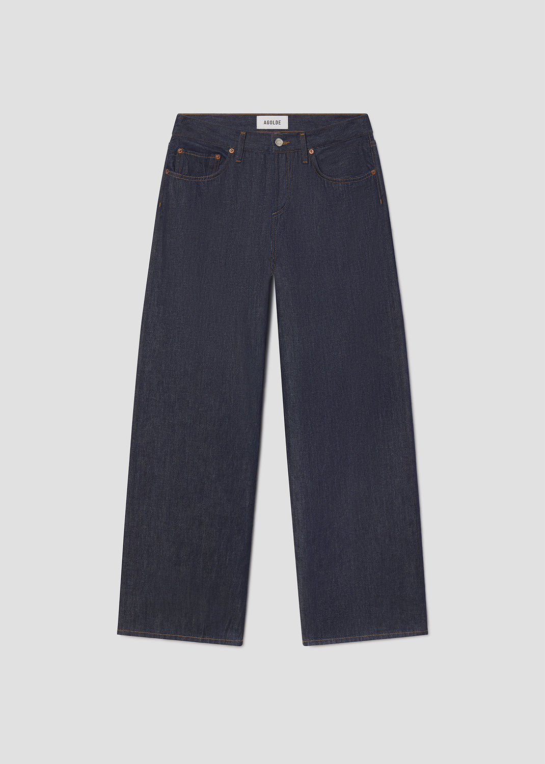 Pair of dark blue jeans on a light gray background