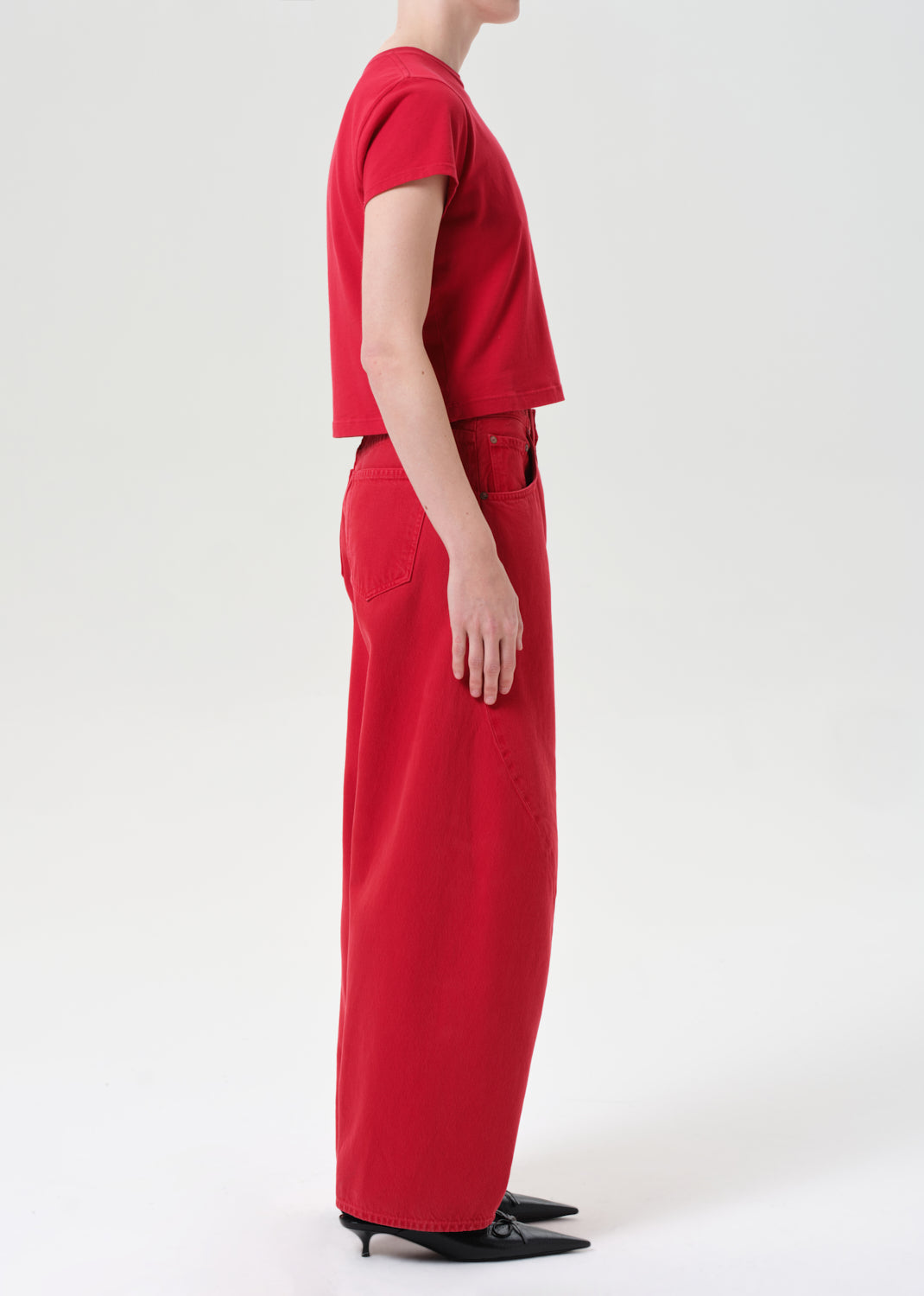Person wearing a red outfit on a white background