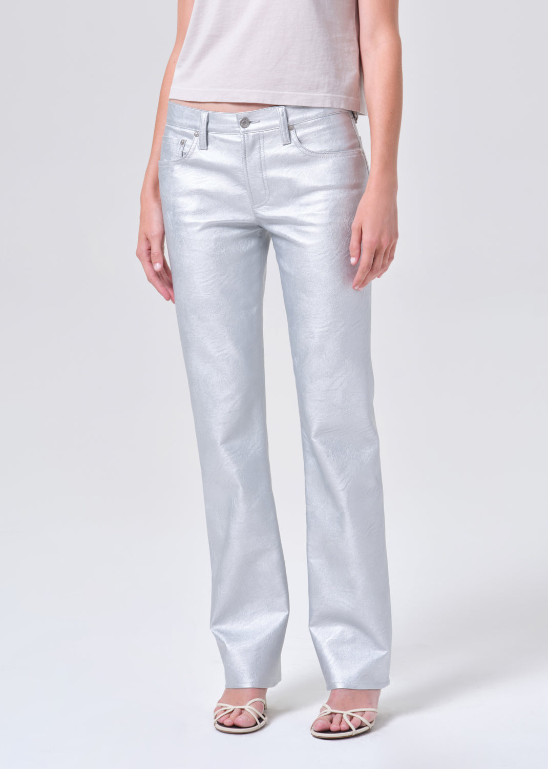 Light blue jeans worn by a person on a white background