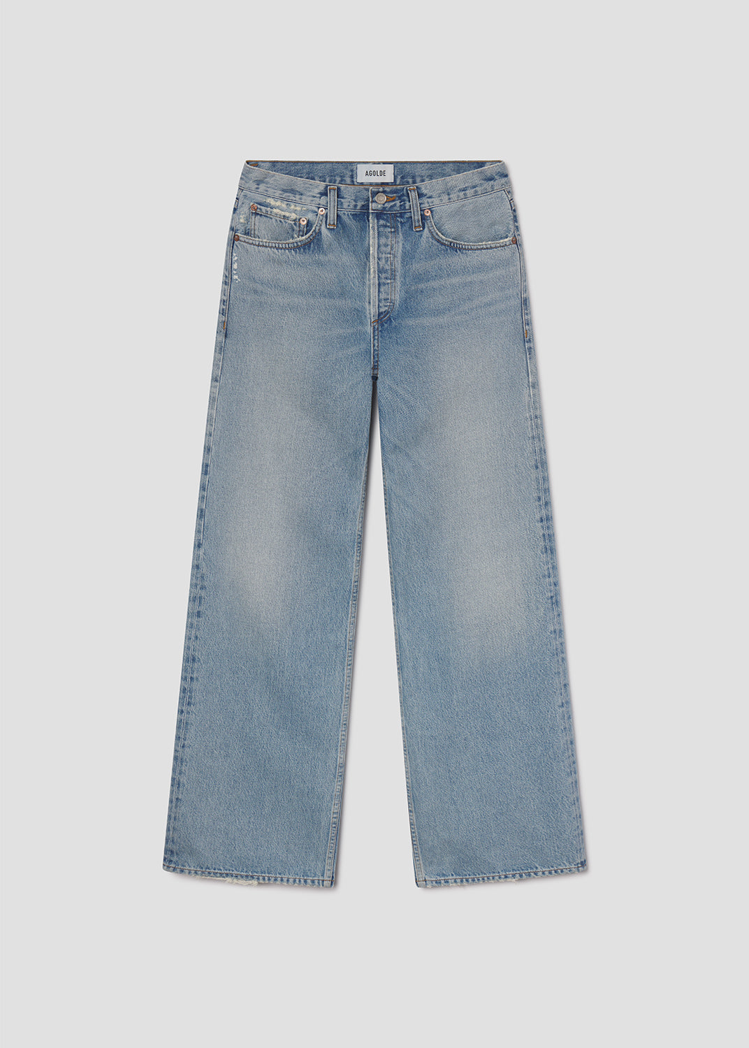 Light blue jeans on a light gray background