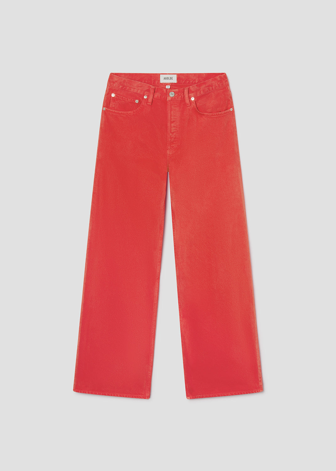 Red jeans on a light gray background