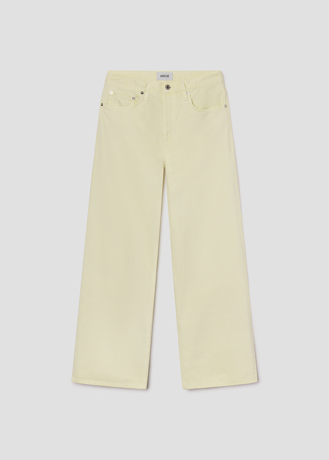 Light yellow jeans on a light gray background