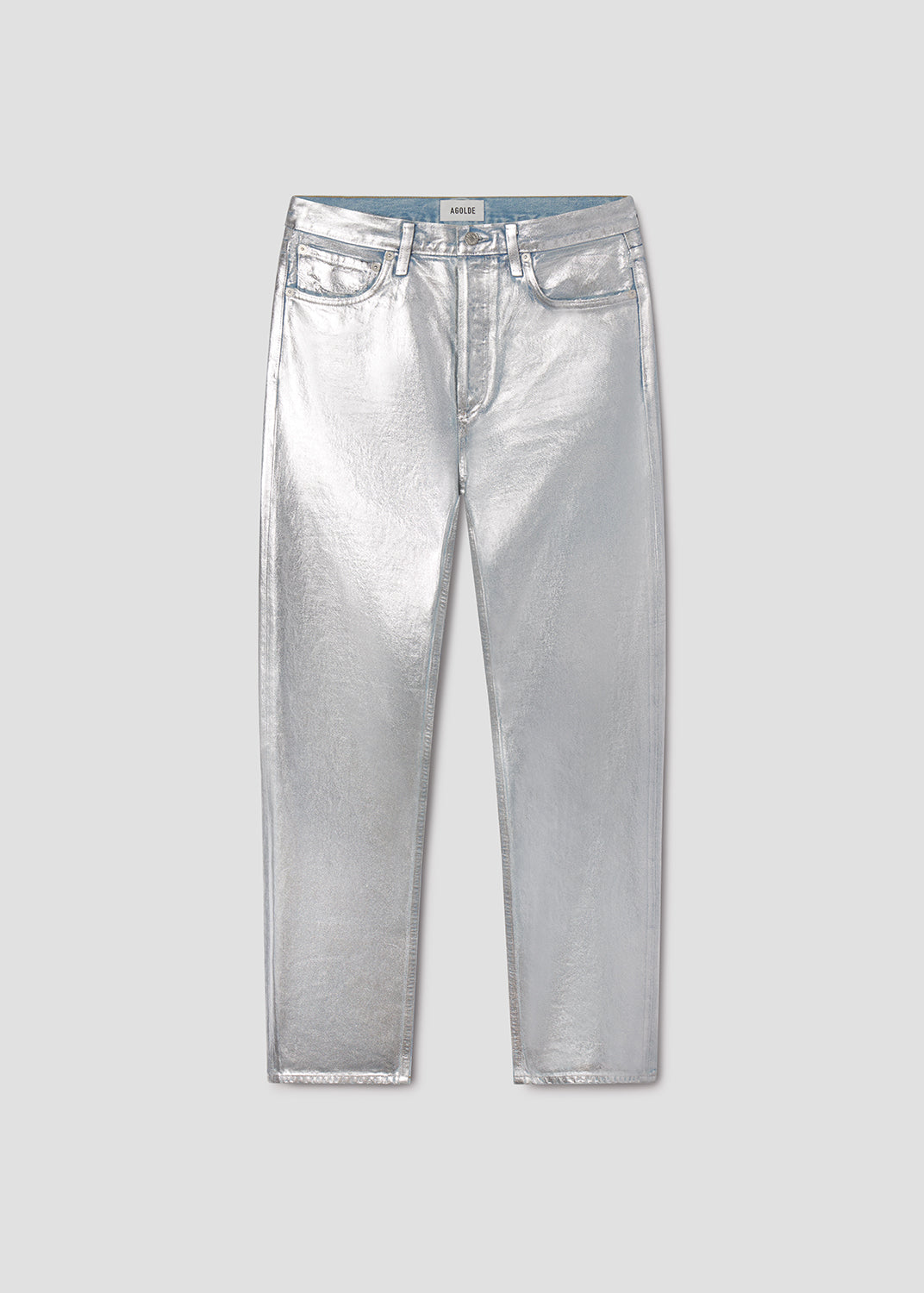 Silver metallic jeans on a light gray background