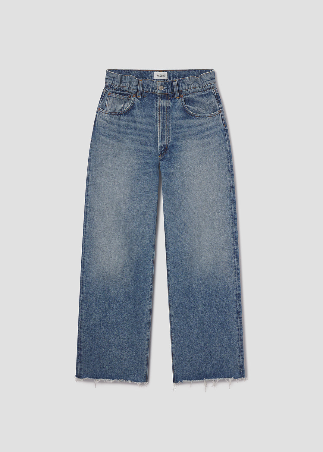 Pair of blue jeans on a light gray background