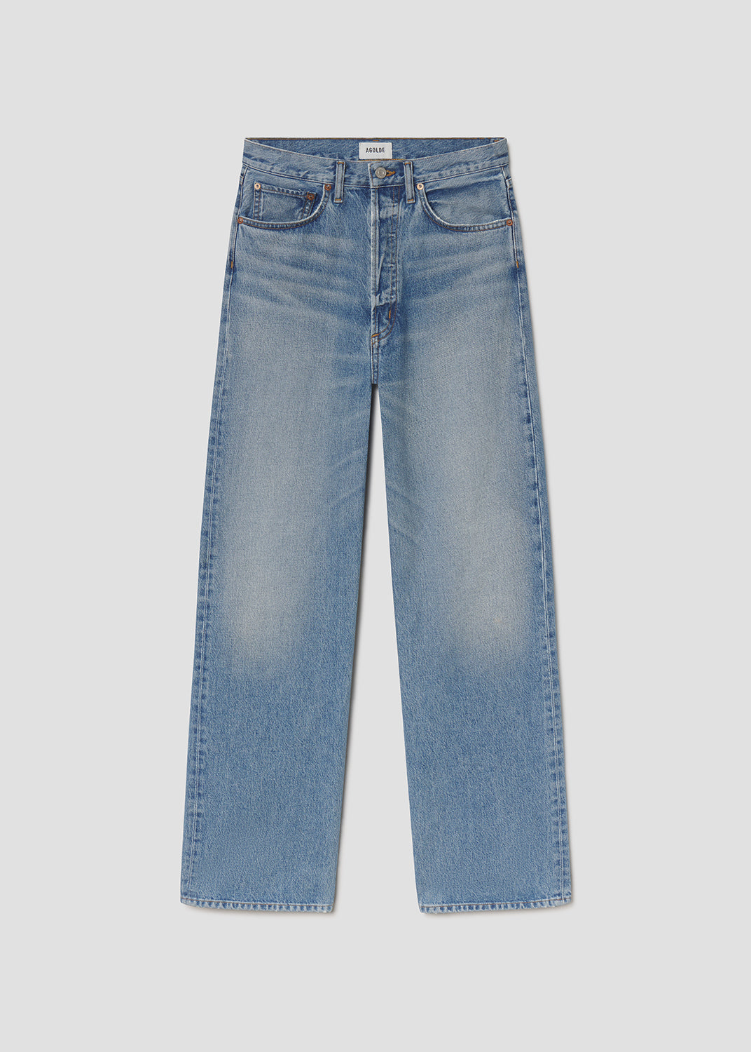 Pair of blue jeans on a light gray background